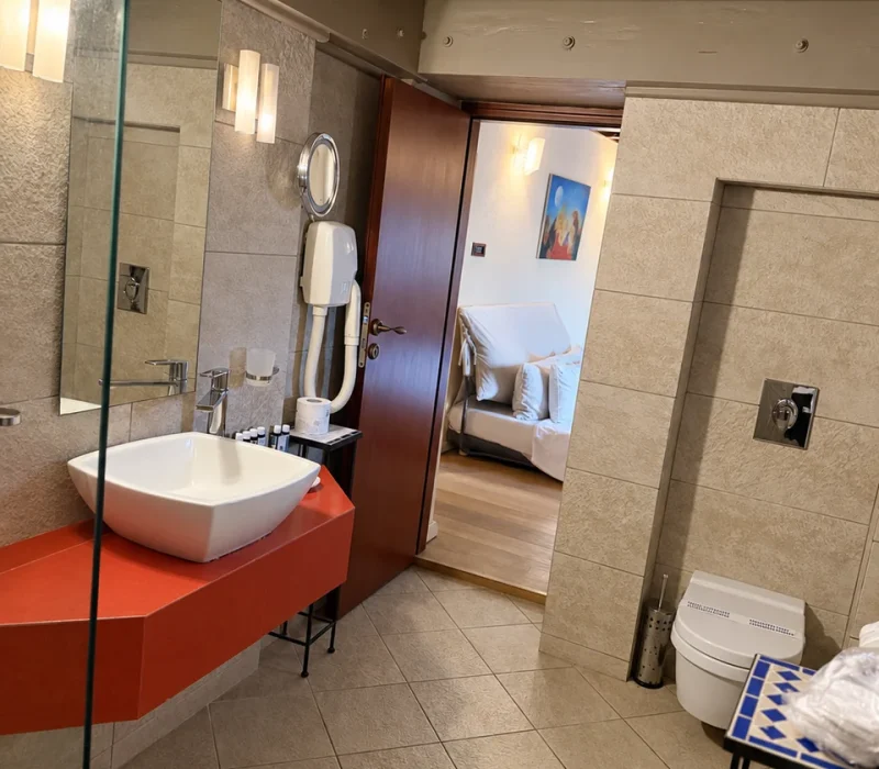 Eros suite renovated bathroom with exposed timber ceiling — view 1, Avalon Boutique Suites Hotel