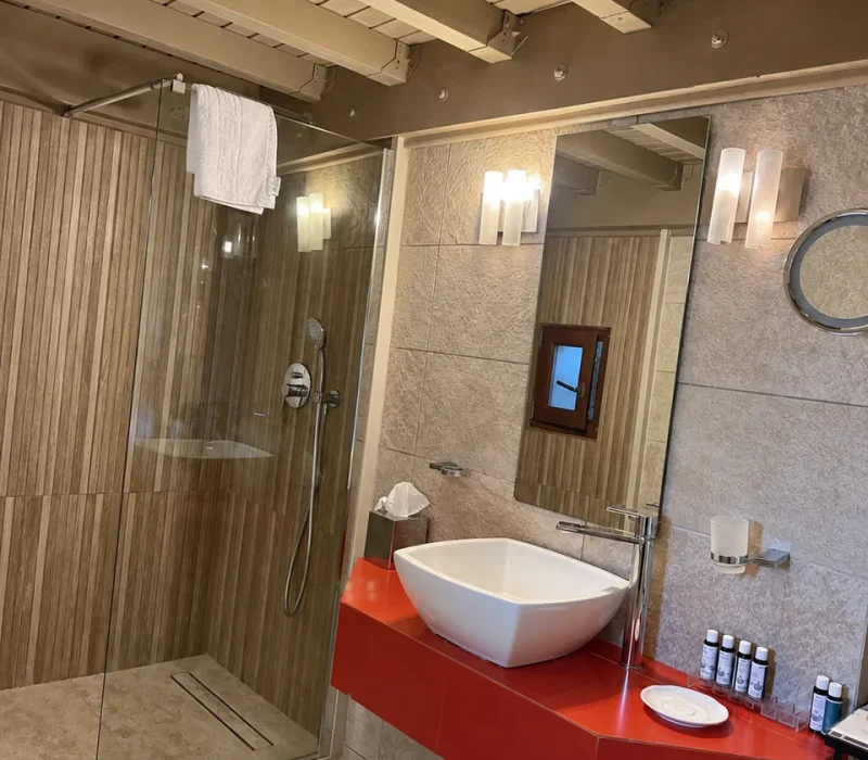Eros suite renovated bathroom with exposed timber ceiling — view 2, Avalon Boutique Suites Hotel