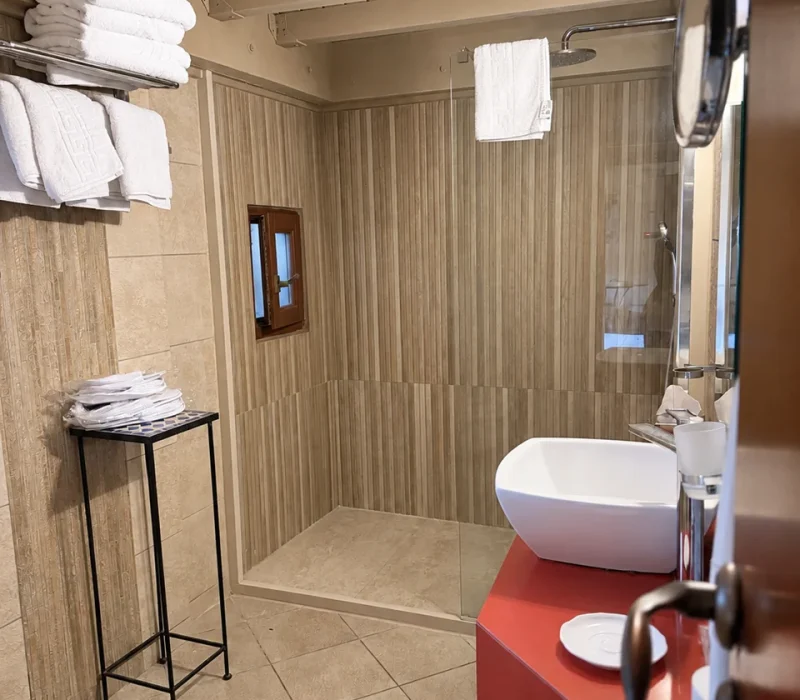 Eros suite renovated bathroom with exposed timber ceiling — view 3, Avalon Boutique Suites Hotel